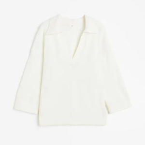 Chompa tejida en punto fino con cuello